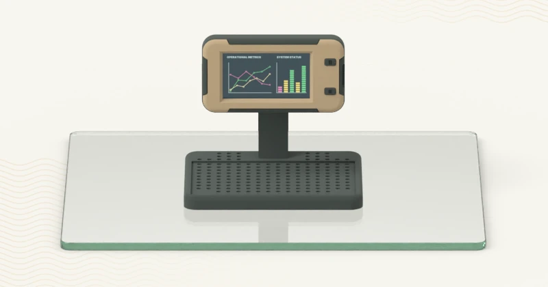 CYD 1.9 inch display in a charcoal and tan 3D-printed stand enclosure, standing on a glass plate